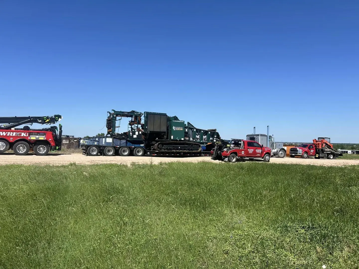 Heavy tracked equipment loaded on a lowboy trailer for transport near Hockley TX